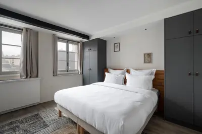 Un ou plusieurs lits dans un hébergement de l'établissement Saint Germain Residence