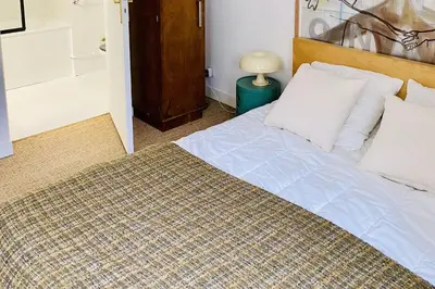 Un ou plusieurs lits dans un hébergement de l'établissement Appartement Sauval - Welkeys