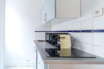 Cuisine ou kitchenette dans l'établissement Studio Avenue Philippe Auguste