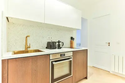 Cuisine ou kitchenette dans l'établissement Charming 2BR - 6P - Eiffel Tower