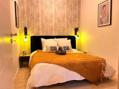 Un ou plusieurs lits dans un hébergement de l'établissement Atelier cosy Père Lachaise & Oberkampf