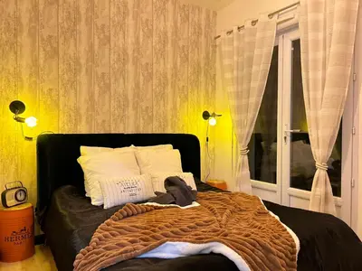 Un ou plusieurs lits dans un hébergement de l'établissement Atelier cosy Père Lachaise & Oberkampf