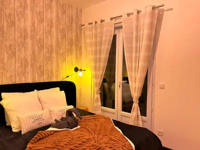Un ou plusieurs lits dans un hébergement de l'établissement Atelier cosy Père Lachaise & Oberkampf