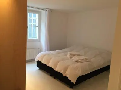 Un ou plusieurs lits dans un hébergement de l'établissement APPARTEMENT AU COEUR DU PARIS TOURISTIQUE