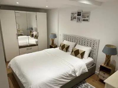 Un ou plusieurs lits dans un hébergement de l'établissement Logement design entier neuf à Paris Gentilly