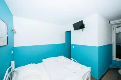 Télévision ou salle de divertissement dans l'établissement Hotel De La Poste