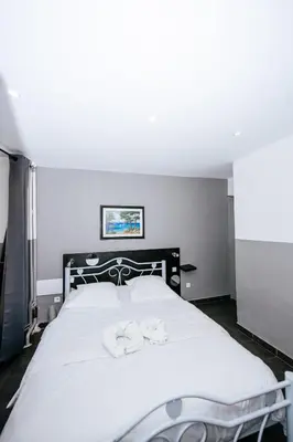 Un ou plusieurs lits dans un hébergement de l'établissement Hotel De La Poste