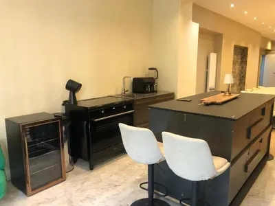 Télévision ou salle de divertissement dans l'établissement Pic de Nôtre Dame, Charming Suites Paris