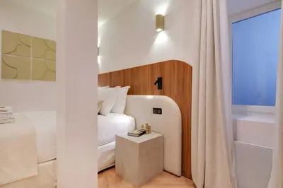 Un ou plusieurs lits dans un hébergement de l'établissement Luxury in the heart or Paris-Notre Dame