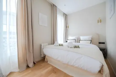 Un ou plusieurs lits dans un hébergement de l'établissement Luxury Flat - Opera & Upper Marais