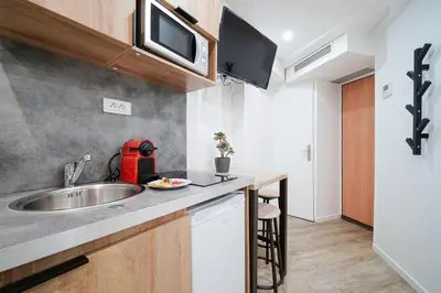 Cuisine ou kitchenette dans l'établissement Nets Inn Apartments - Saint Lazare
