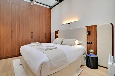Un ou plusieurs lits dans un hébergement de l'établissement Spacious Apartment - 3BDR-6P