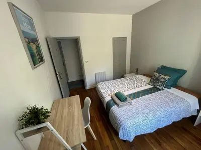 Un ou plusieurs lits dans un hébergement de l'établissement MA - Maison 10 min PARIS EXPOS - 8 chambres