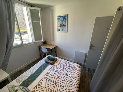 Un ou plusieurs lits dans un hébergement de l'établissement MA - Maison 10 min PARIS EXPOS - 8 chambres