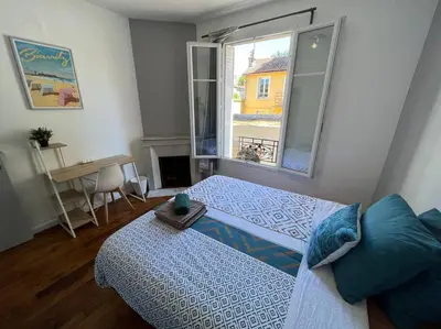 Un ou plusieurs lits dans un hébergement de l'établissement MA - Maison 10 min PARIS EXPOS - 8 chambres