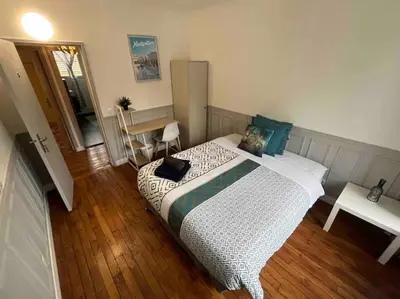 Un ou plusieurs lits dans un hébergement de l'établissement MA - Maison 10 min PARIS EXPOS - 8 chambres