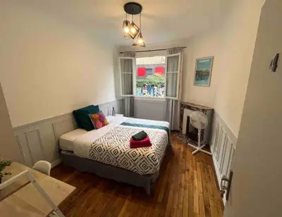 Un ou plusieurs lits dans un hébergement de l'établissement MA - Maison 10 min PARIS EXPOS - 8 chambres