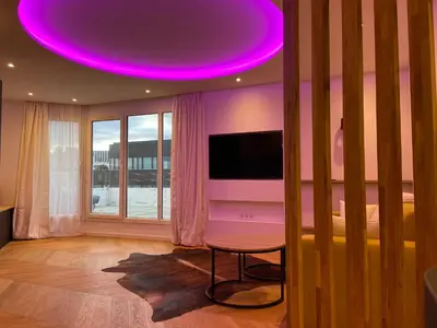 Télévision ou salle de divertissement dans l'établissement Luxury Penthouse Eiffel Tower view