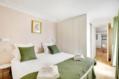 Un ou plusieurs lits dans un hébergement de l'établissement Pick A Flat's Apartment in Opéra/Grands-Boulevards - Rue de Provence