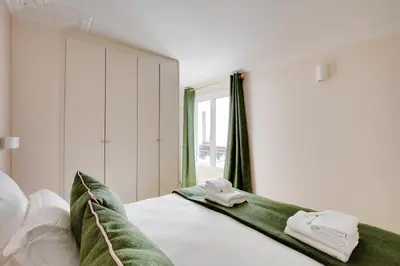 Un ou plusieurs lits dans un hébergement de l'établissement Pick A Flat's Apartment in Opéra/Grands-Boulevards - Rue de Provence