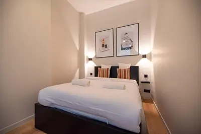 Un ou plusieurs lits dans un hébergement de l'établissement Lovely Flat in the marais