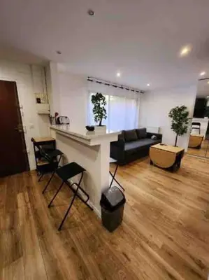 Coin salon dans l'établissement Superbe appartement à 8 minutes de la nation.