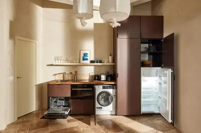 Cuisine ou kitchenette dans l'établissement Cosy 1BR with outside space neighboring Le Marais