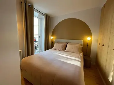 Un ou plusieurs lits dans un hébergement de l'établissement Marais - Bright one-bedroom decorated with taste