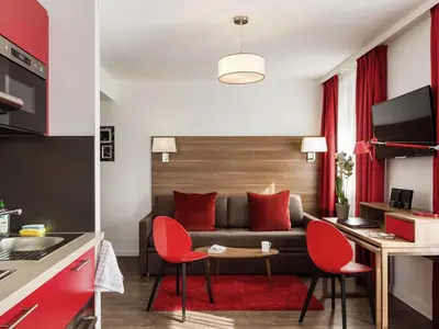Télévision ou salle de divertissement dans l'établissement Aparthotel Adagio La Defense Courbevoie