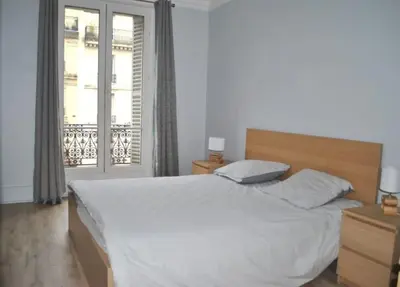 Un ou plusieurs lits dans un hébergement de l'établissement Appartement de 80 m² proche Gare du Nord