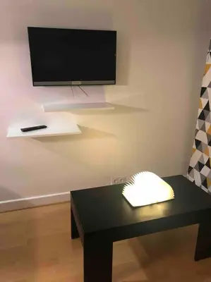 Télévision ou salle de divertissement dans l'établissement Mignonnette