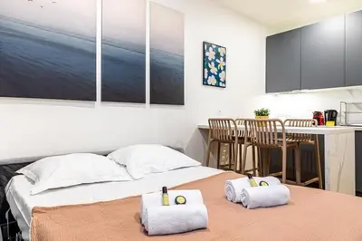Un ou plusieurs lits dans un hébergement de l'établissement Appartement moderne pour 4 proche Arc de Triomphe