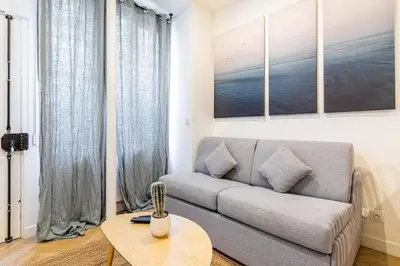 Coin salon dans l'établissement Appartement moderne pour 4 proche Arc de Triomphe