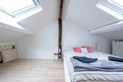 Un ou plusieurs lits dans un hébergement de l'établissement Duplex 45m2 -Zac L’Oreal - Palais de Justice Paris