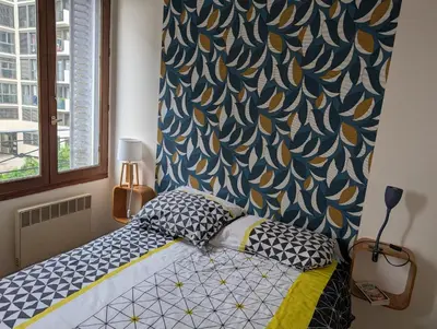Un ou plusieurs lits dans un hébergement de l'établissement Studio Paris buttes Chaumont