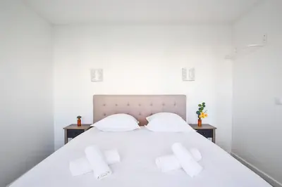 Un ou plusieurs lits dans un hébergement de l'établissement Amazing Appartment 4 Peoples