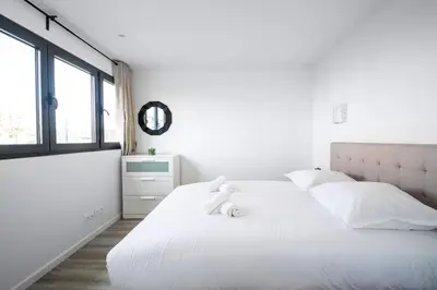 Un ou plusieurs lits dans un hébergement de l'établissement Amazing Appartment 4 Peoples