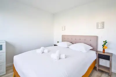 Un ou plusieurs lits dans un hébergement de l'établissement Amazing Appartment 4 Peoples