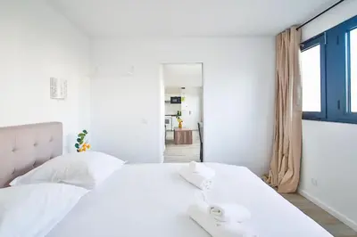 Un ou plusieurs lits dans un hébergement de l'établissement Amazing Appartment 4 Peoples