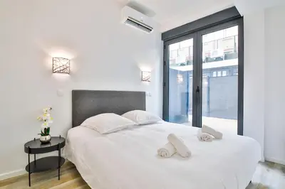 Un ou plusieurs lits dans un hébergement de l'établissement Jolie appartement près du métro
