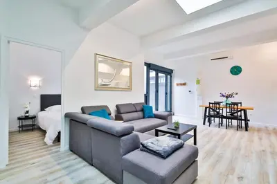 Coin salon dans l'établissement Jolie appartement près du métro