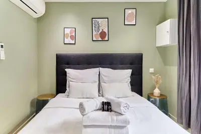 Un ou plusieurs lits dans un hébergement de l'établissement Apartment Center of Paris by Studio prestige