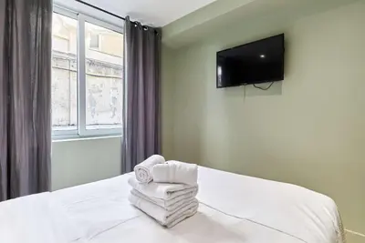 Télévision ou salle de divertissement dans l'établissement Apartment Center of Paris by Studio prestige