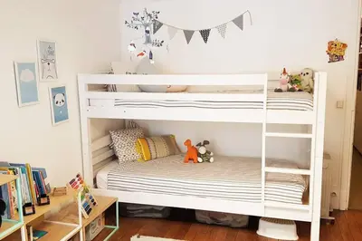 Un ou plusieurs lits dans un hébergement de l'établissement Paris Langeac Apartments