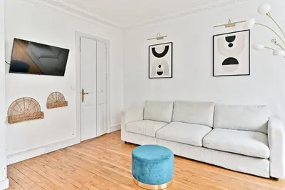 Coin salon dans l'établissement Appartement proche Gare Montparnasse - IV