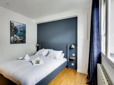 Un ou plusieurs lits dans un hébergement de l'établissement Amazing Apartment: 2BR/4P -Bastille/Saint Ambroise