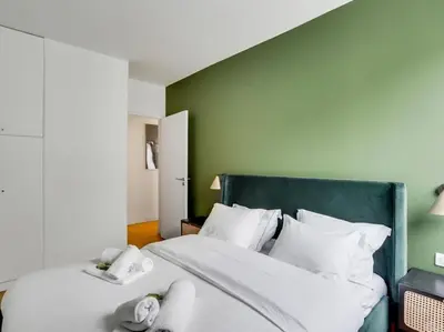 Un ou plusieurs lits dans un hébergement de l'établissement Amazing Apartment: 2BR/4P -Bastille/Saint Ambroise