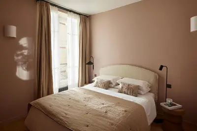 Un ou plusieurs lits dans un hébergement de l'établissement Marais - 4 pièces de 115 m2 - grand salon convivial