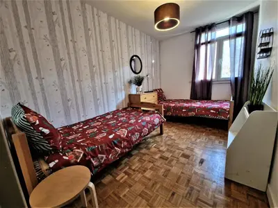 Un ou plusieurs lits dans un hébergement de l'établissement Appart' convivial 3 Ch 73m² à proximité de Paris