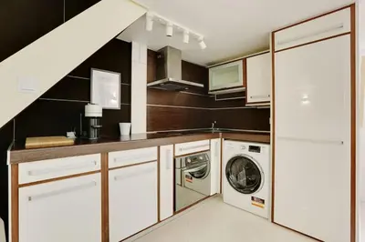 Cuisine ou kitchenette dans l'établissement Jardin plaisance